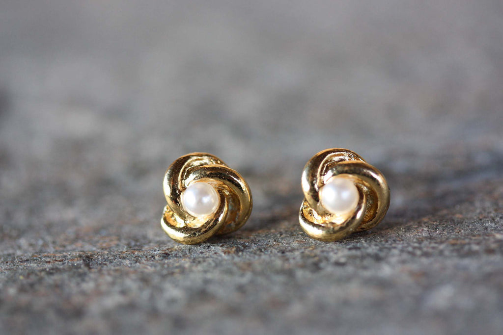 Vintage gold pearl swirl studs from Diament Jewelry, a gift shop in Washington, DC.