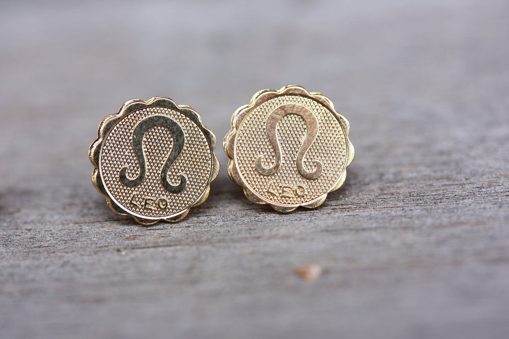 Gold Leo Astrology Studs from Diament Jewelry, a gift shop in Washington, DC.