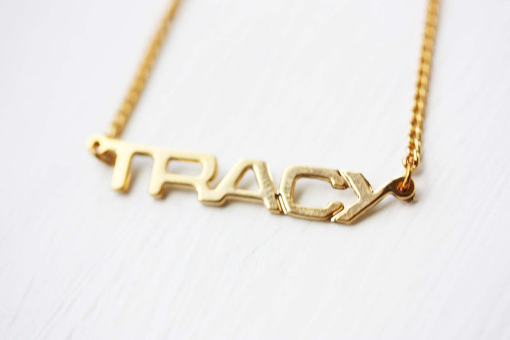 Vintage Tracy gold name necklace from Diament Jewelry, a gift shop in Washington, DC.