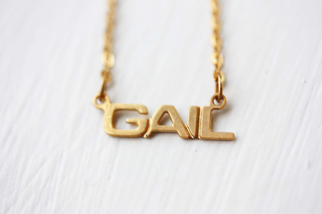 Vintage Gail gold name necklace from Diament Jewelry, a gift shop in Washington, DC.
