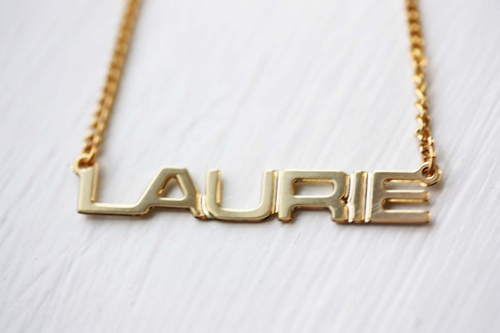 Vintage Laurie gold name necklace from Diament Jewelry, a gift shop in Washington, DC.