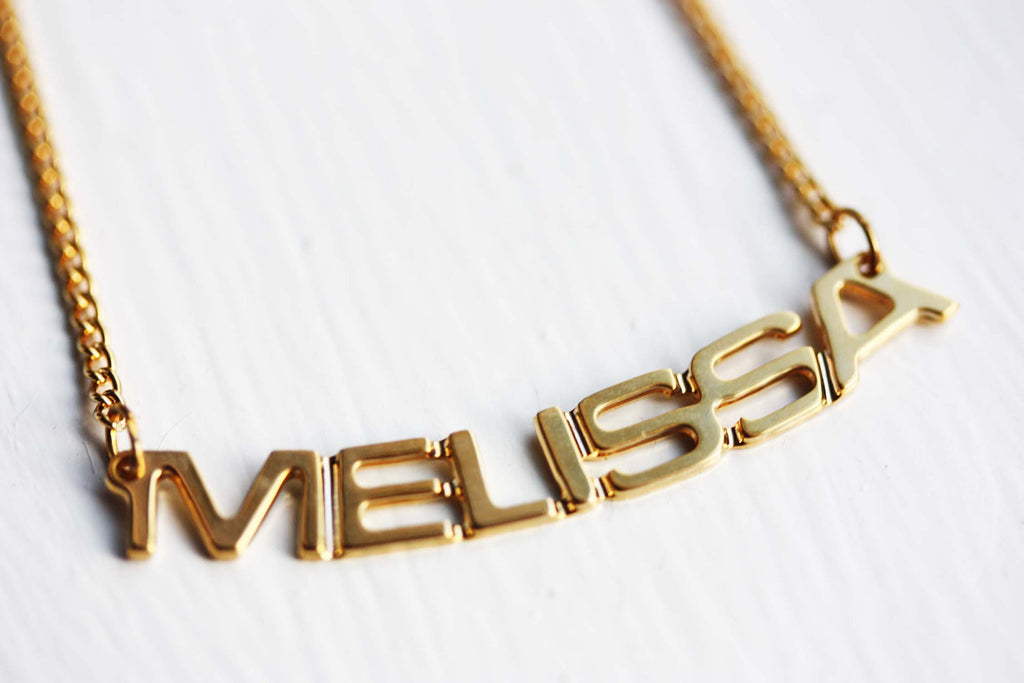 Vintage Melissa gold name necklace from Diament Jewelry, a gift shop in Washington, DC.