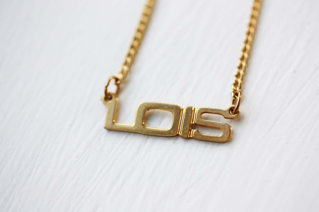 Vintage Lois gold name necklace from Diament Jewelry, a gift shop in Washington, DC.