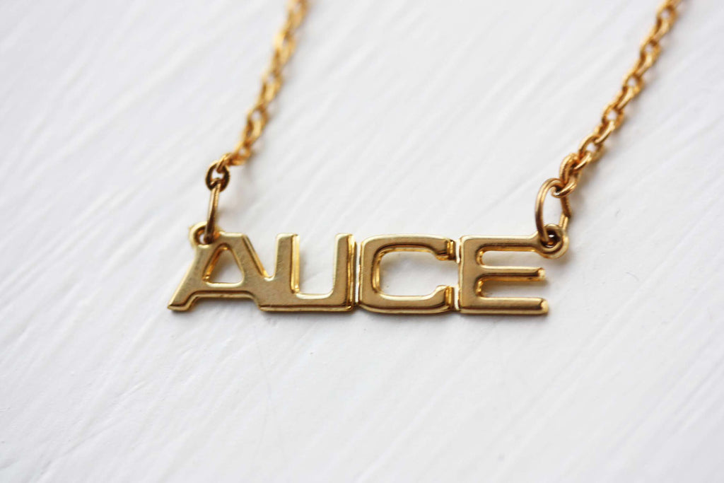 Vintage Alice gold name necklace from Diament Jewelry, a gift shop in Washington, DC.