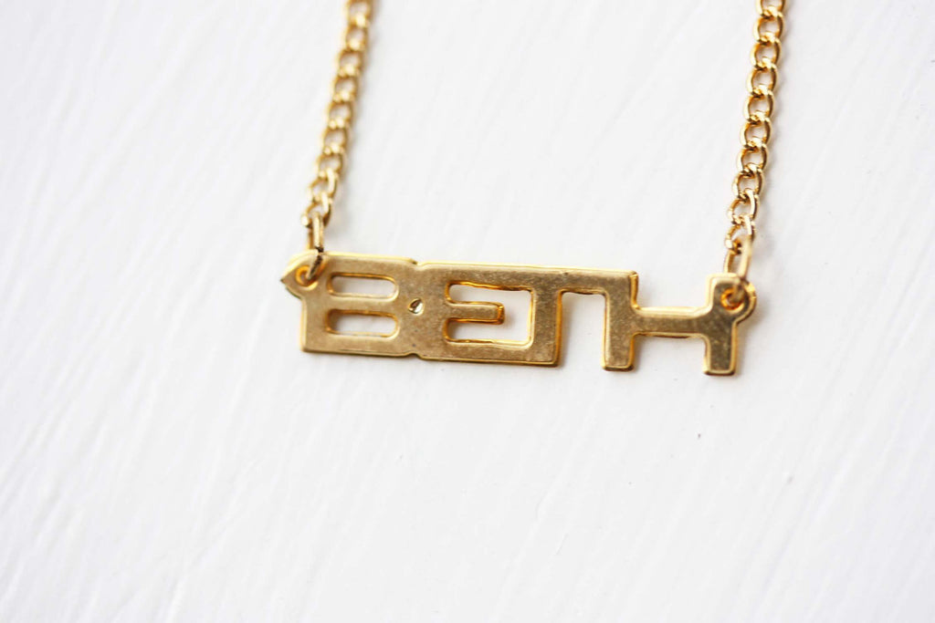 Vintage Beth gold name necklace from Diament Jewelry, a gift shop in Washington, DC.