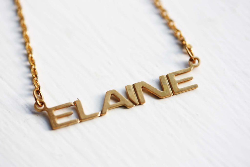 Vintage Elaine gold name necklace from Diament Jewelry, a gift shop in Washington, DC.