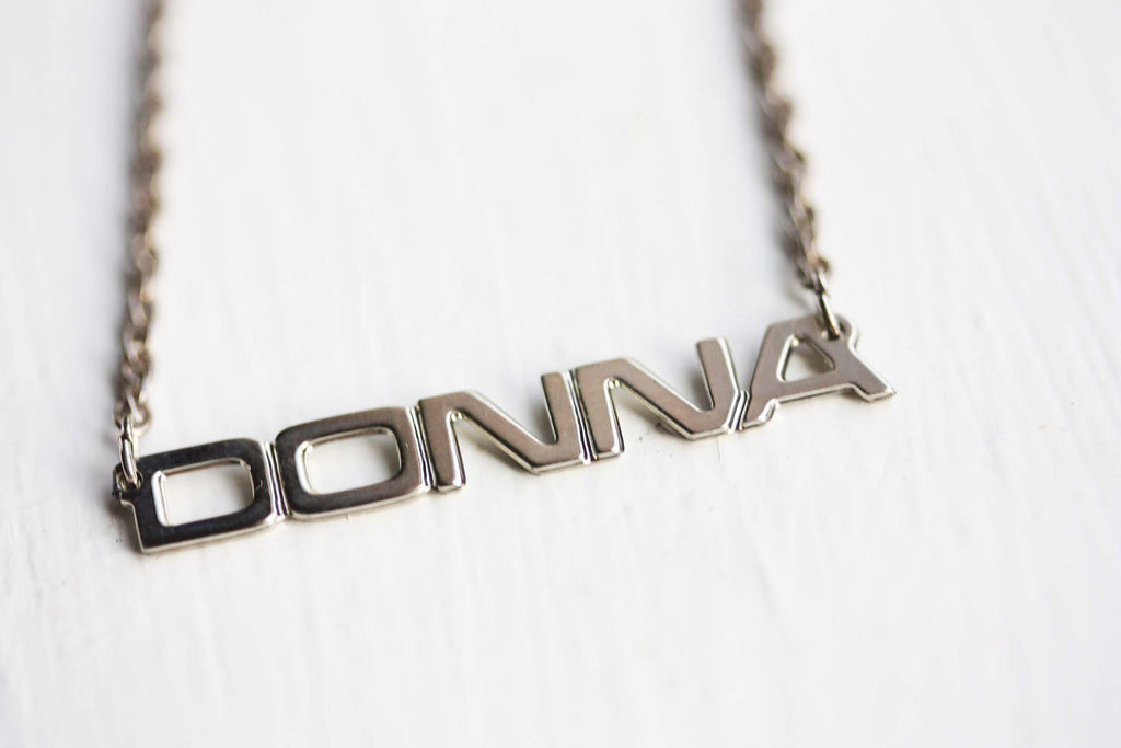 Vintage Donna silver name necklace from Diament Jewelry, a gift shop in Washington, DC.