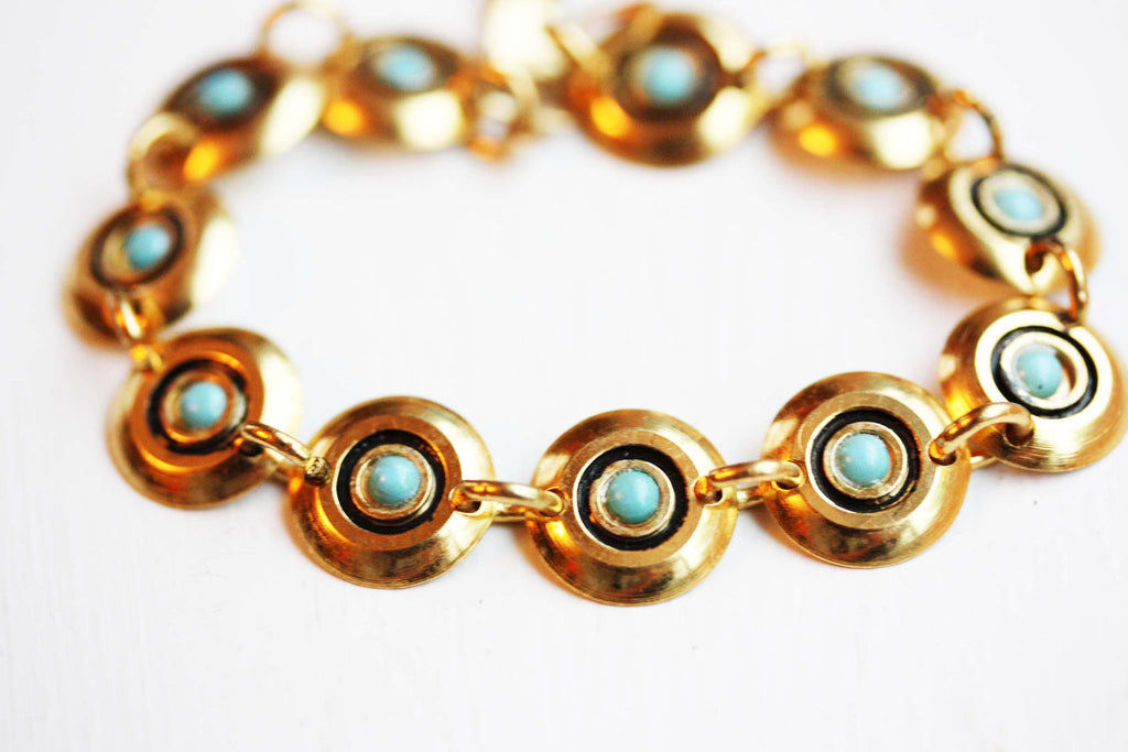 Gold and turquoise cleopatra bracelet from Diament Jewelry, a gift shop in Washington, DC.