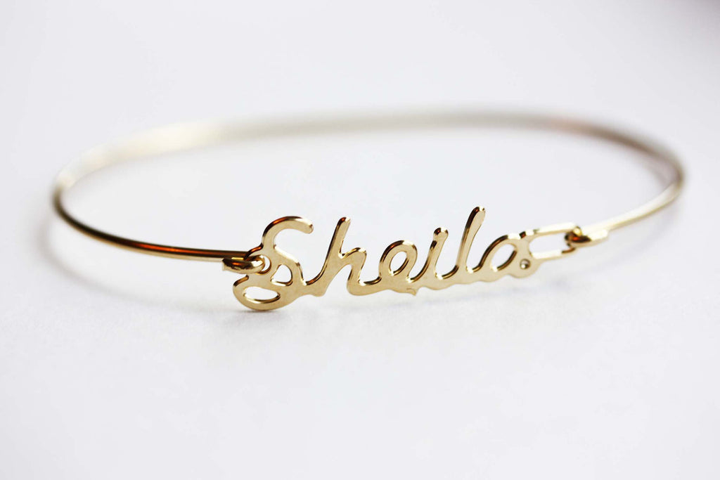 Vintage Sheila gold name bracelet from Diament Jewelry, a gift shop in Washington, DC.