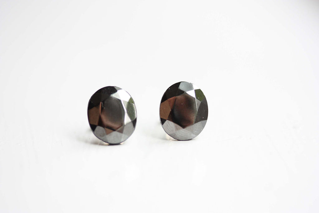 Silver metallic studs from Diament Jewelry, a gift shop in Washington, DC.