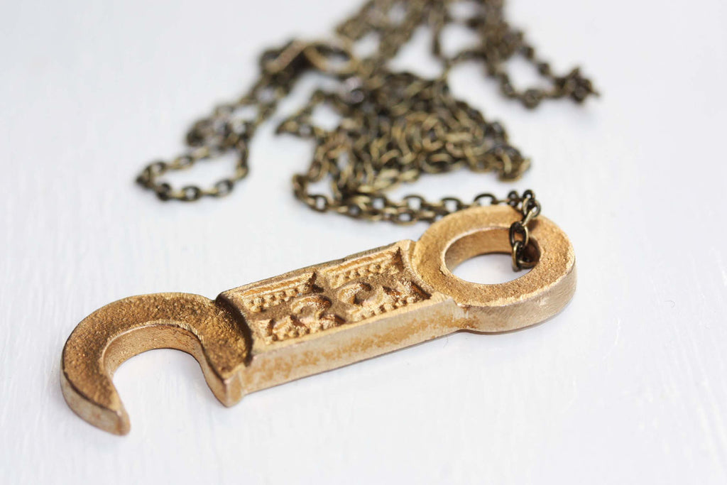 Brass hook necklace from Diament Jewelry, a gift shop in Washington, DC.
