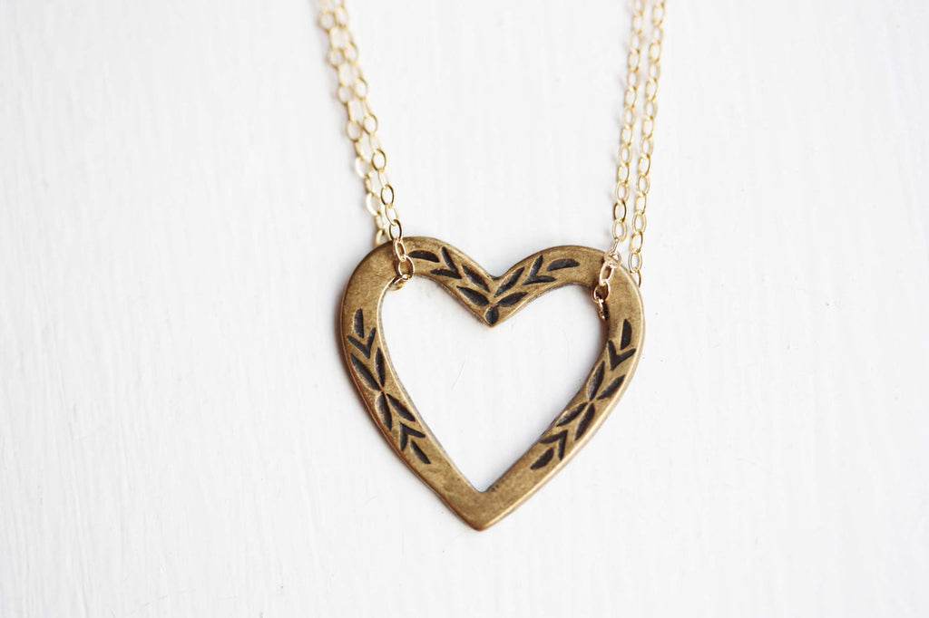 Etched gold heart necklace from Diament Jewelry, a gift shop in Washington, DC.