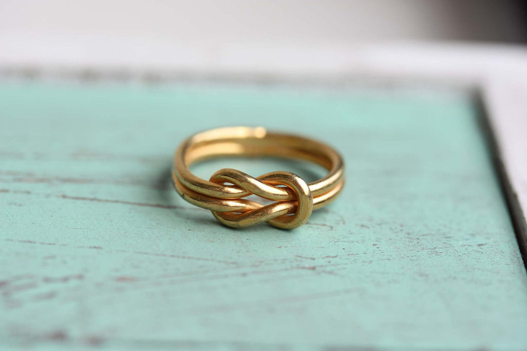 Vintage gold double sailor knot ring from Diament Jewelry, a gift shop in Washington, DC.