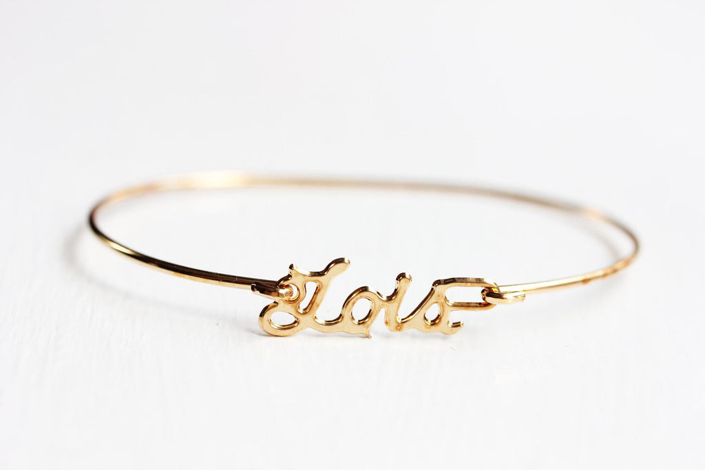 Vintage Lois gold name bracelet from Diament Jewelry, a gift shop in Washington, DC.