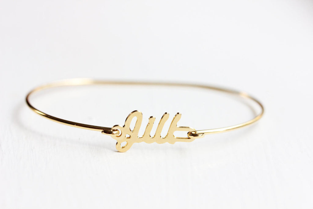 Vintage Jill gold name bracelet from Diament Jewelry, a gift shop in Washington, DC.