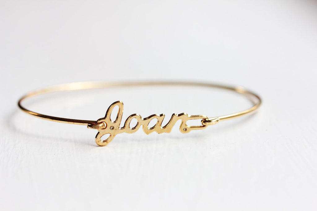 Vintage Joan gold name bracelet from Diament Jewelry, a gift shop in Washington, DC.