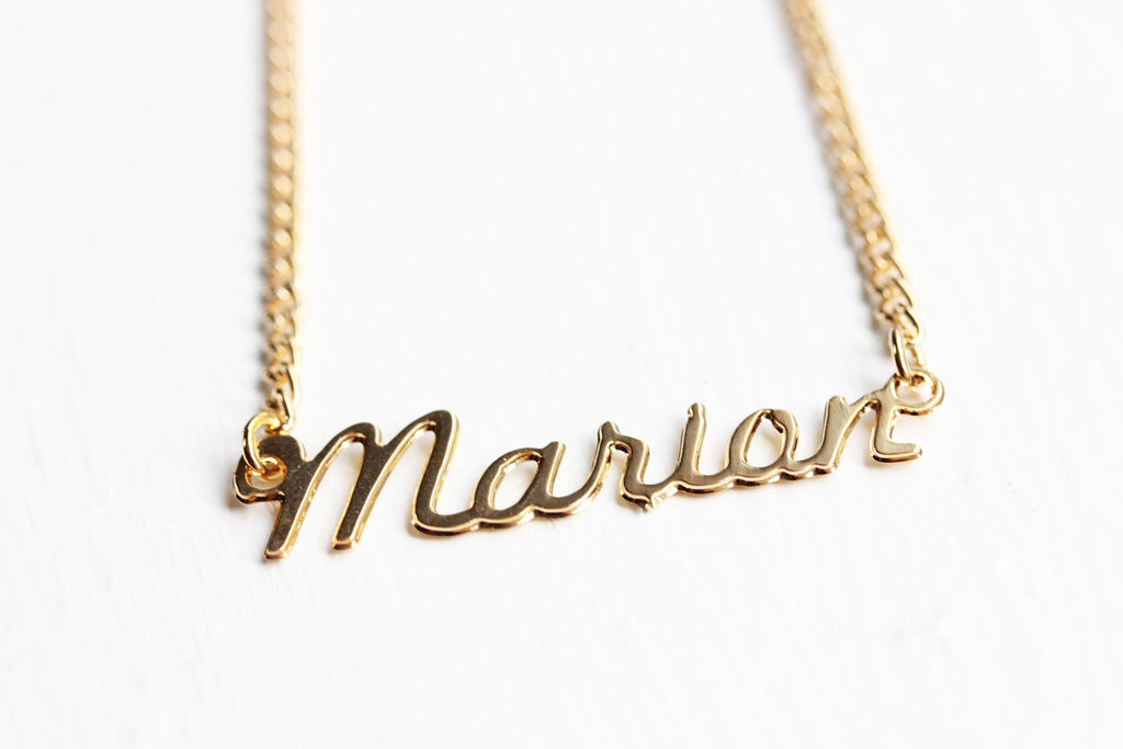 Vintage Marian gold name necklace from Diament Jewelry, a gift shop in Washington, DC.