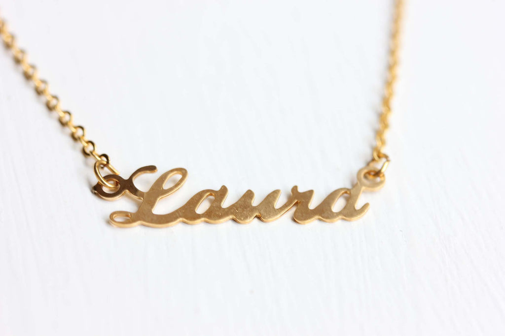 Vintage gold Laura name necklace from Diament Jewelry, a gift shop in Washington, DC.