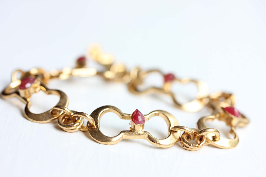 Gold oval link ruby bracelet from Diament Jewelry, a gift shop in Washington, DC.