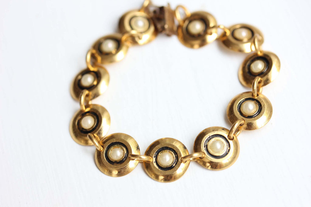 White and gold cleopatra bracelet from Diament Jewelry, a gift shop in Washington, DC.