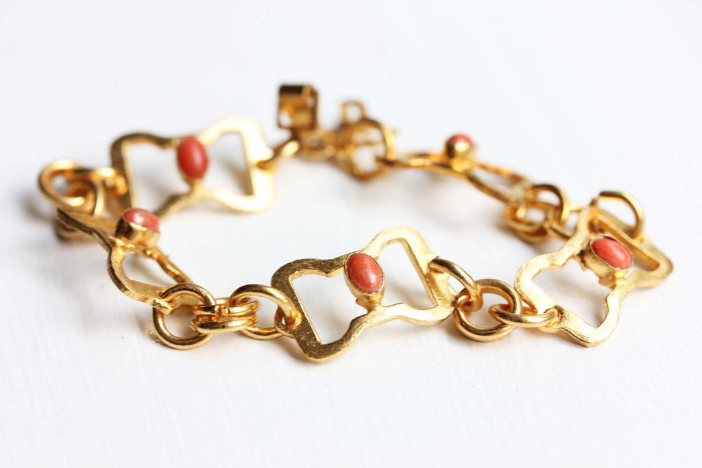 Gold oval link coral bracelet from Diament Jewelry, a gift shop in Washington, DC.
