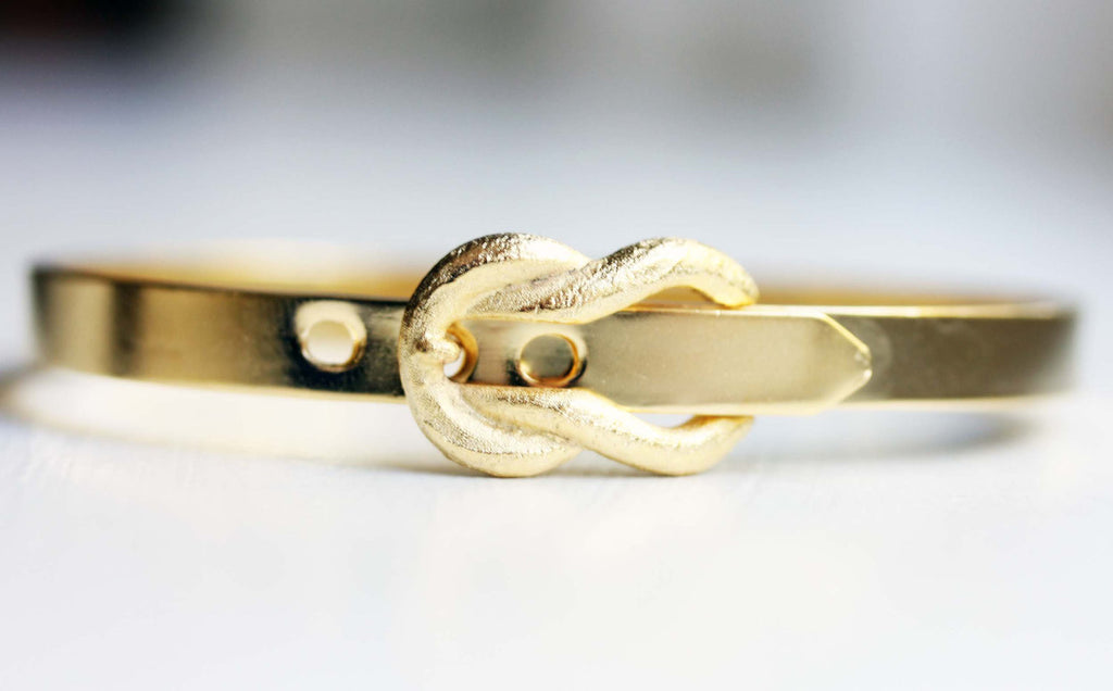 Gold buckle bracelet from Diament Jewelry, a gift shop in Washington, DC.
