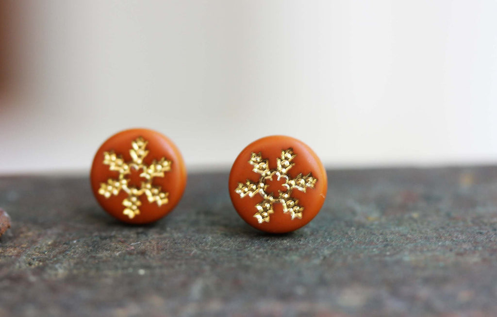 Tiny orange and gold flower studs from Diament Jewelry, a gift shop in Washington, DC.