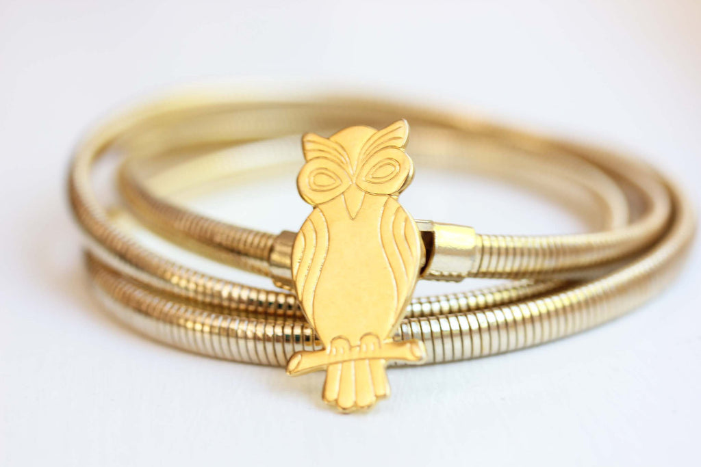 Gold M Owl coil belt from Diament Jewelry, a gift shop in Washington, DC.