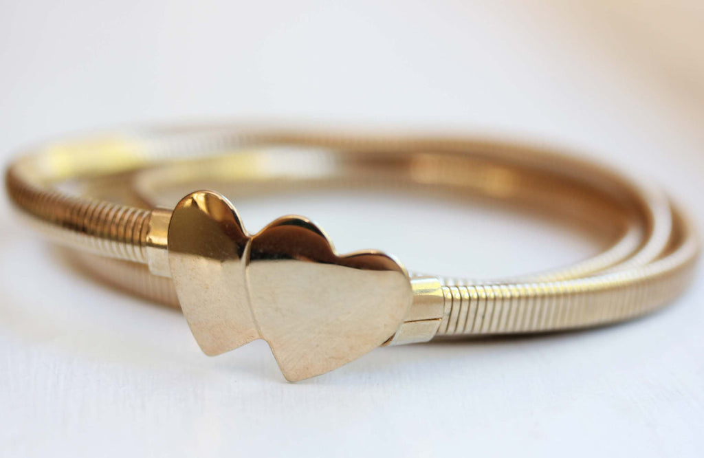 Double heart M gold coil belt from Diament Jewelry, a gift shop in Washington, DC.