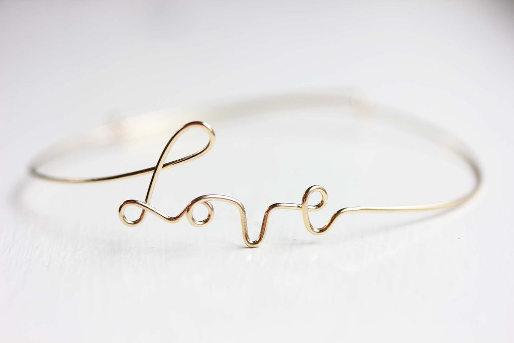 Wire gold love adjustable bracelet Diament Jewelry, a gift shop in Washington, DC.