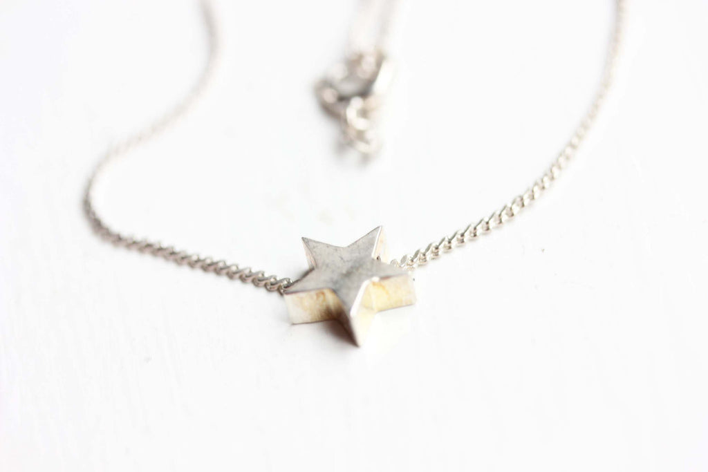 Silver star chain bracelet from Diament Jewelry, a gift shop in Washington, DC.