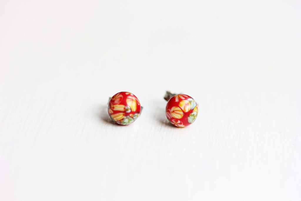 Vintage Japanese red confetti studs from Diament Jewelry, a gift shop in Washington, DC.