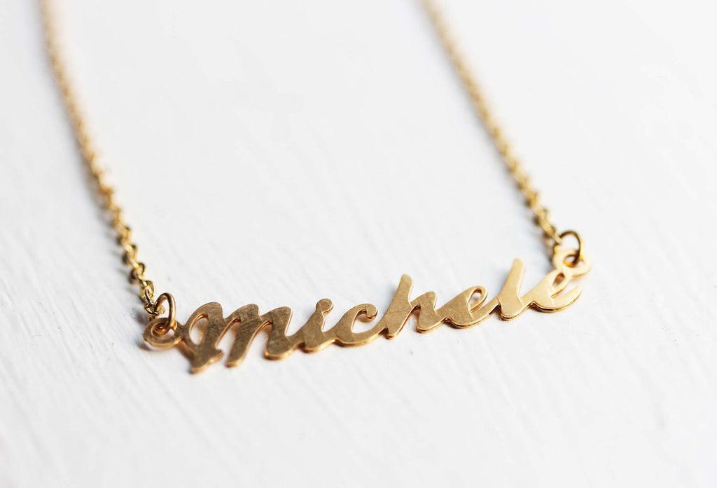 Vintage Michele gold name necklace from Diament Jewelry, a gift shop in Washington, DC.