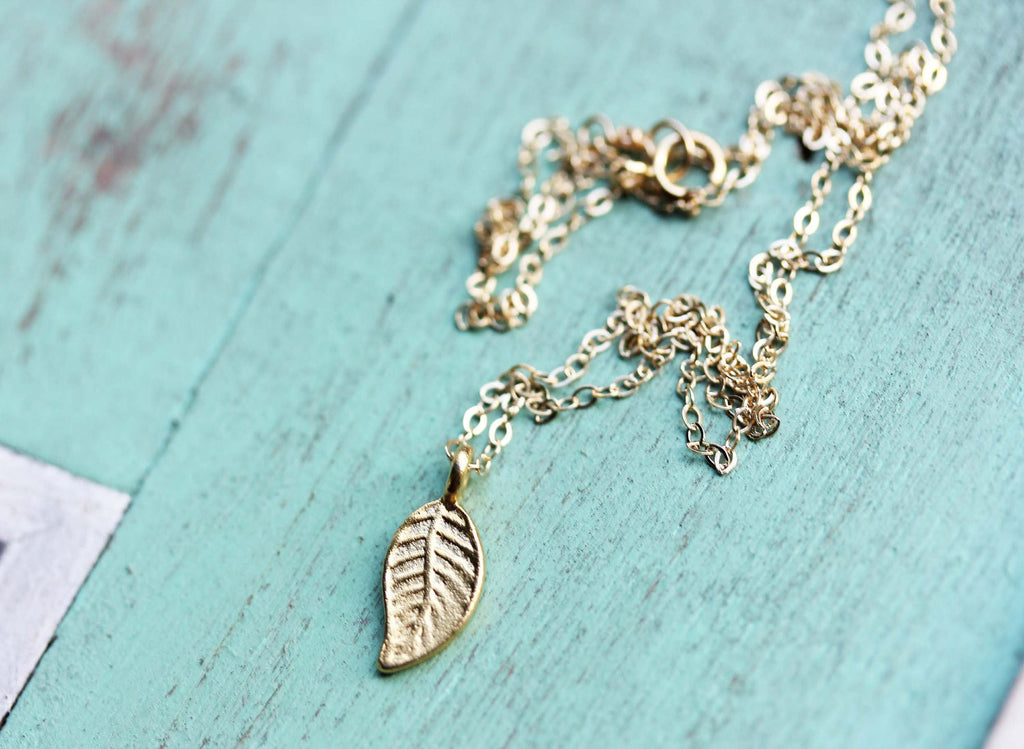 Tiny gold fill leaf necklace from Diament Jewelry, a gift shop in Washington, DC.