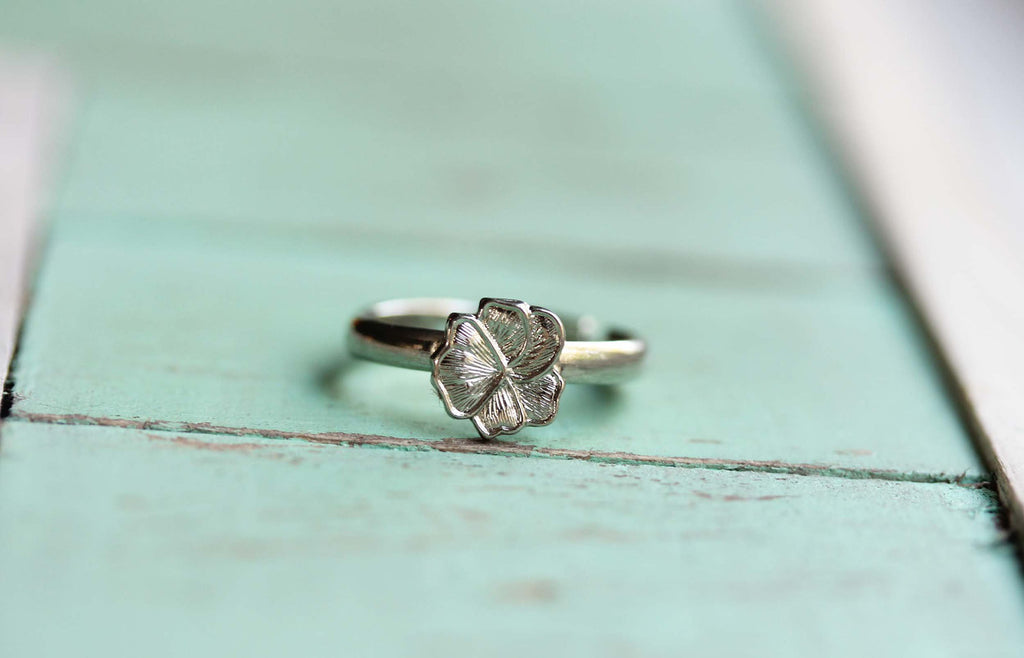 Tiny silver flower ring from Diament Jewelry, a gift shop in Washington, DC.