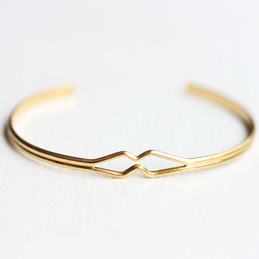 Vintage gold wire diamond shaped adjustable cuff bracelet from Diament Jewelry, a gift shop in Washington, DC.