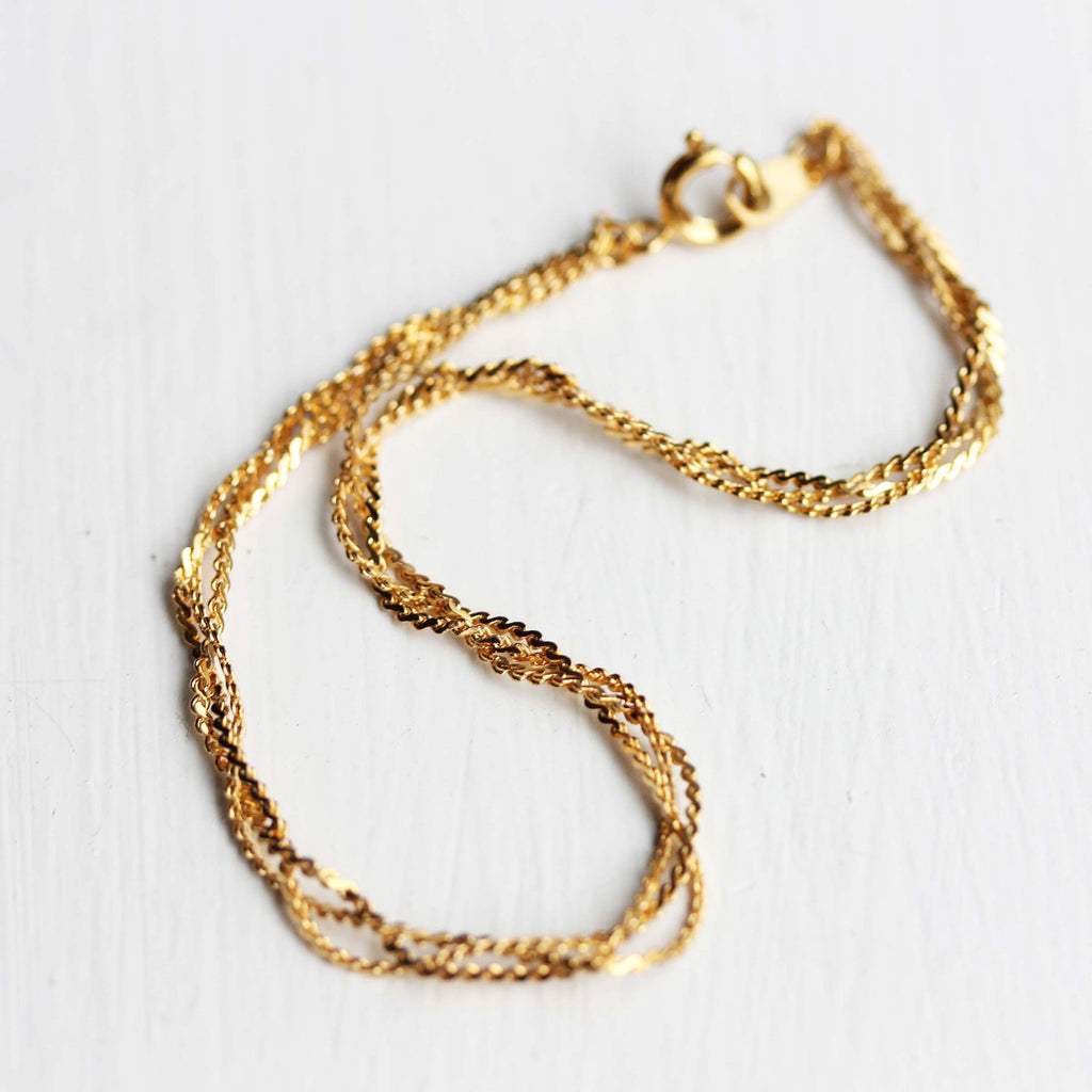 Gold braided bracelet from Diament Jewelry, a gift shop in Washington, DC.