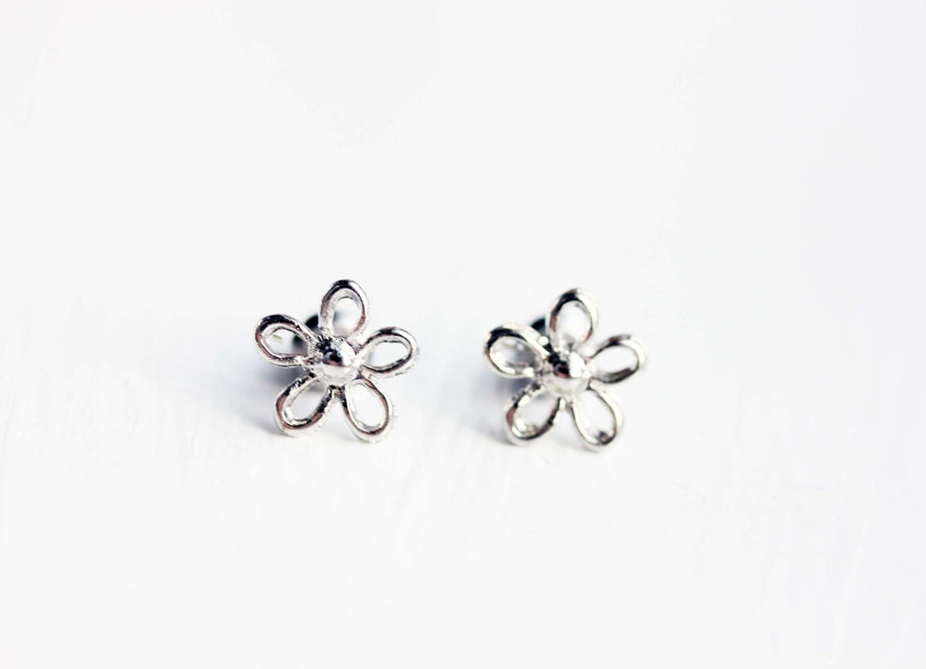 Silver daisy wire studs from Diament Jewelry, a gift shop in Washington, DC.