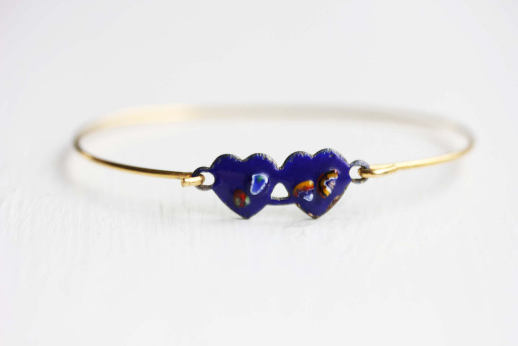 Double heart navy gold hook bracelet from Diament Jewelry, a gift shop in Washington, DC.