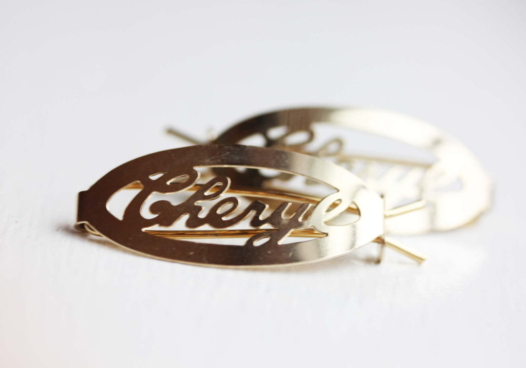 Vintage Cheryl gold hair clips from Diament Jewelry, a gift shop in Washington, DC.