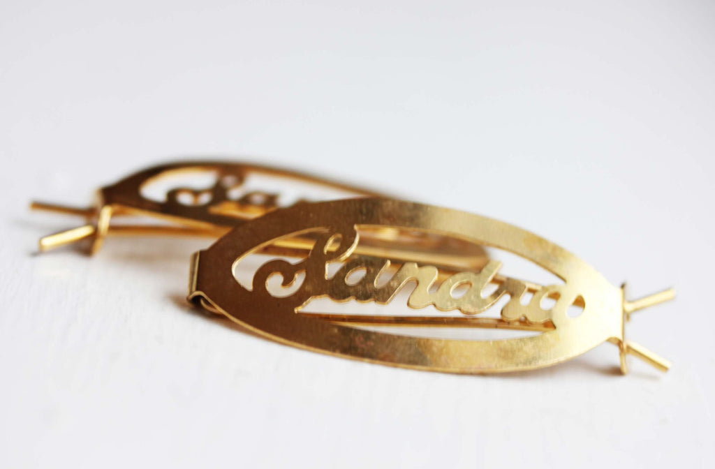 Vintage Sandra gold hair clips from Diament Jewelry, a gift shop in Washington, DC.