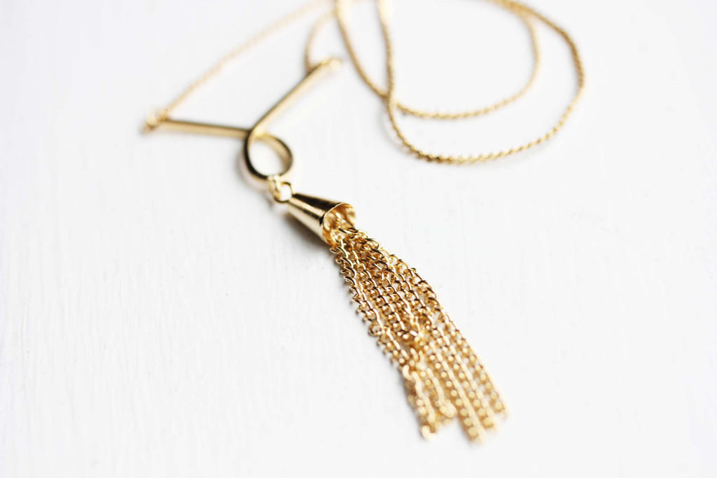 Gold Tassel Necklaces from Diament Jewelry, a gift shop in Washington, DC.