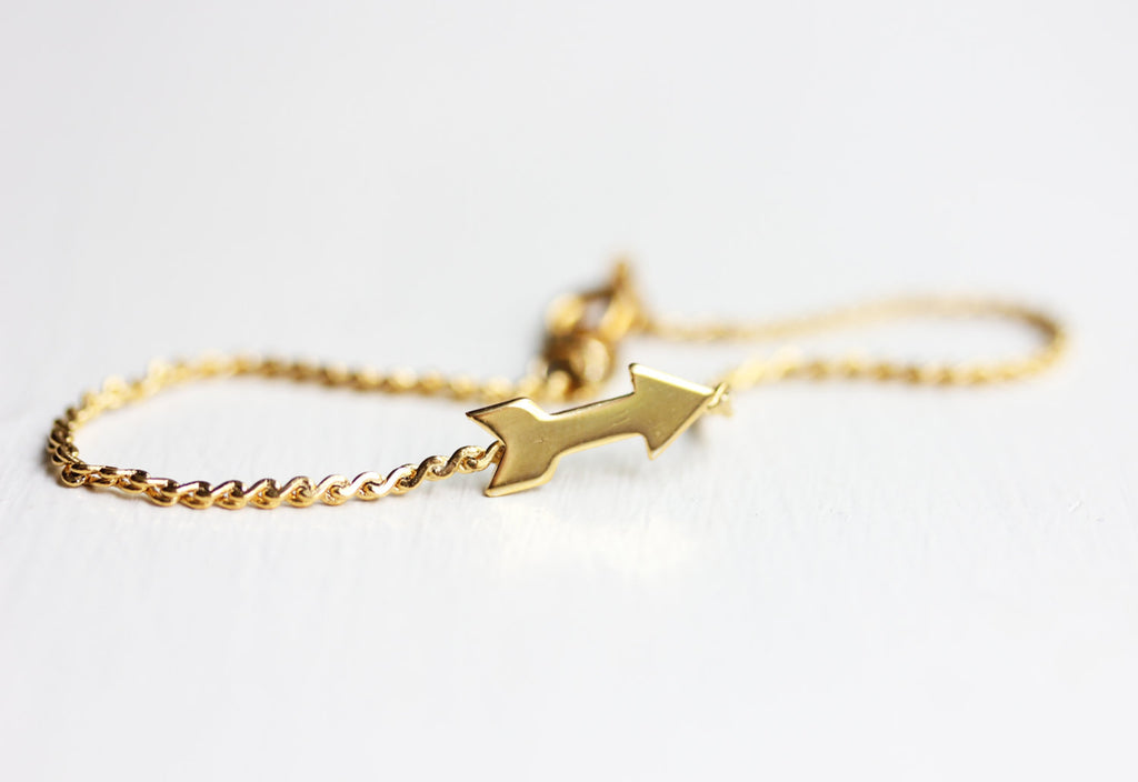 Gold arrow bracelet from Diament Jewelry, a gift shop in Washington, DC.
