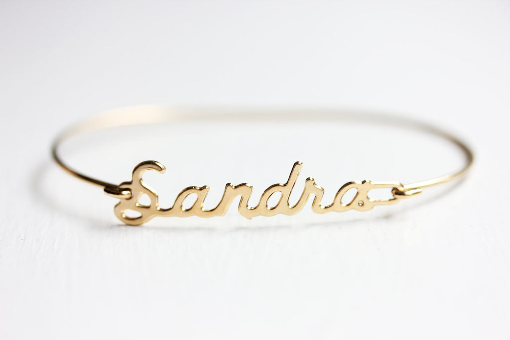 Vintage Sandra gold name bracelet from Diament Jewelry, a gift shop in Washington, DC.