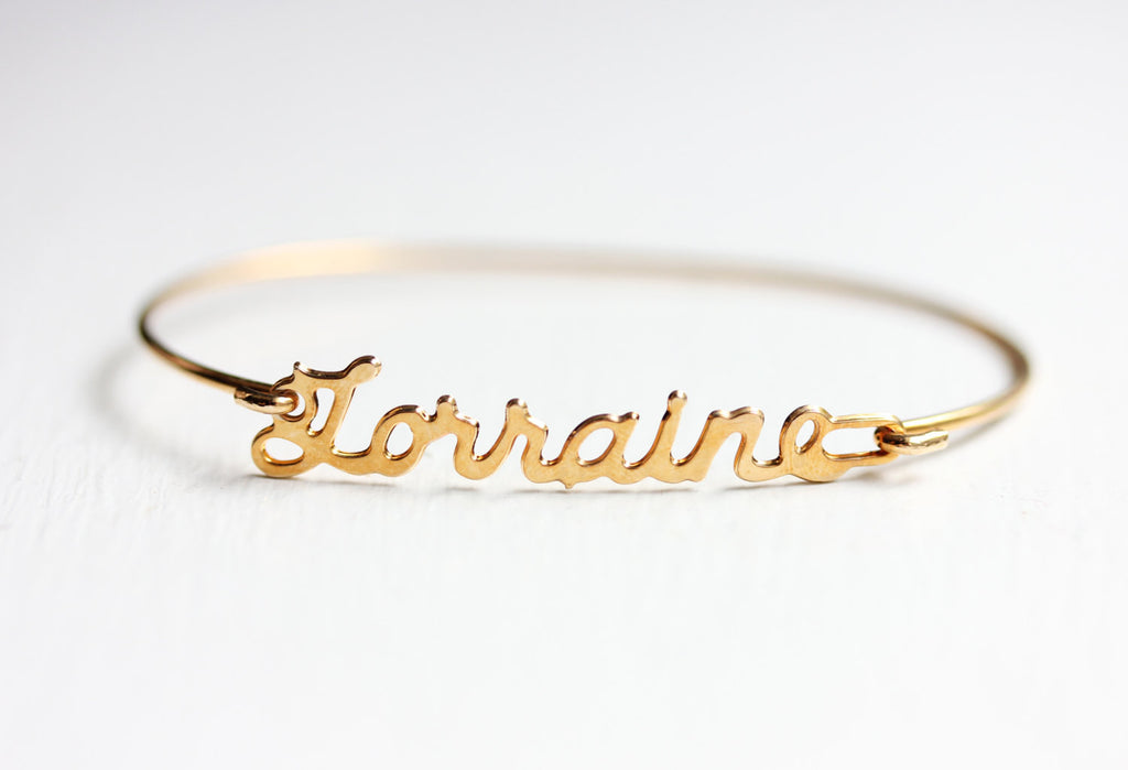 Vintage Lorraine Gold name bracelet from Diament Jewelry, a gift shop in Washington, DC.