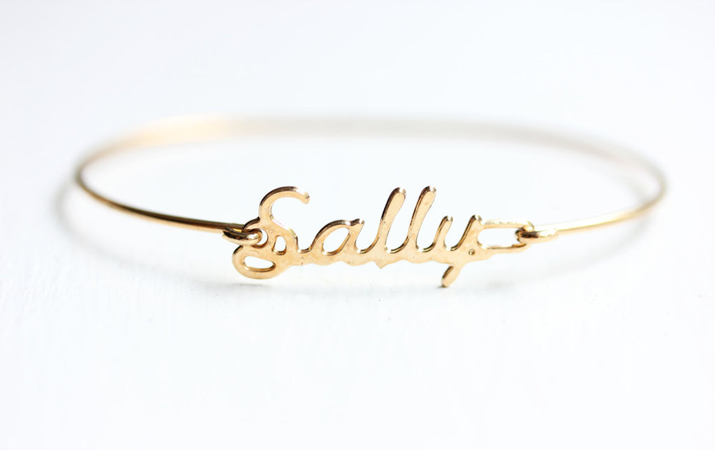 Vintage Sally gold name bracelet from Diament Jewelry, a gift shop in Washington, DC.