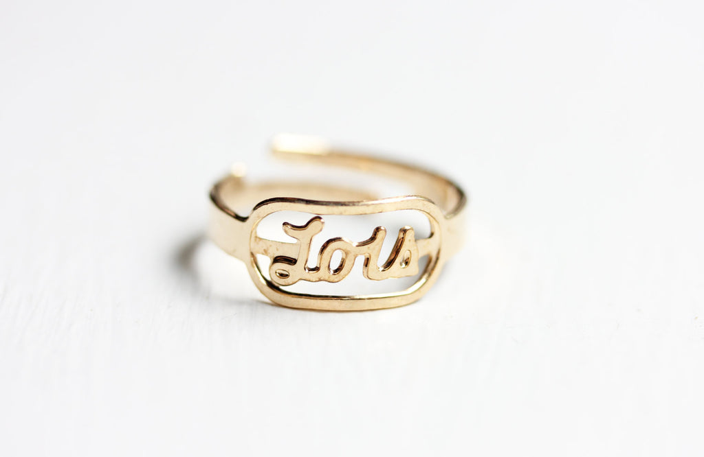 Vintage Lois gold name ring from Diament Jewelry, a gift shop in Washington, DC.