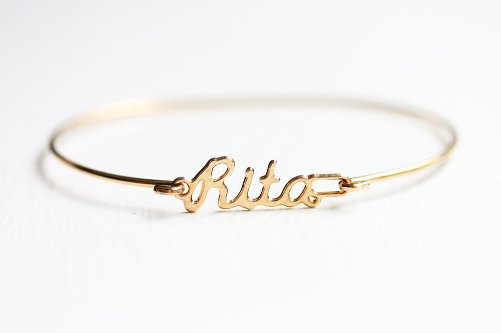 Vintage Rita gold name bracelet from Diament Jewelry, a gift shop in Washington, DC.