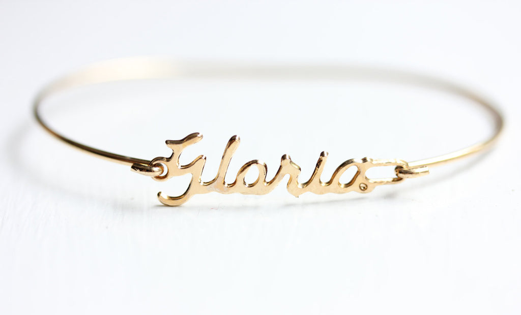 Vintage Gloria Gold Name Bracelet from Diament Jewelry, a gift shop in Washington, DC.