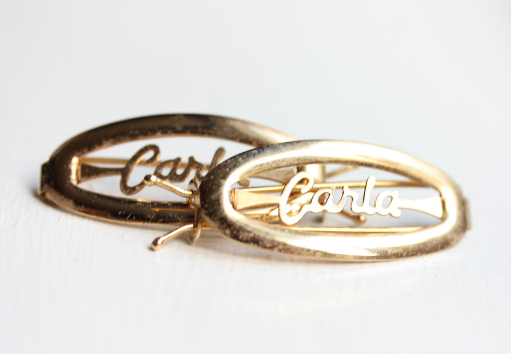 Vintage Carla gold hair clips from Diament Jewelry, a gift shop in Washington, DC.